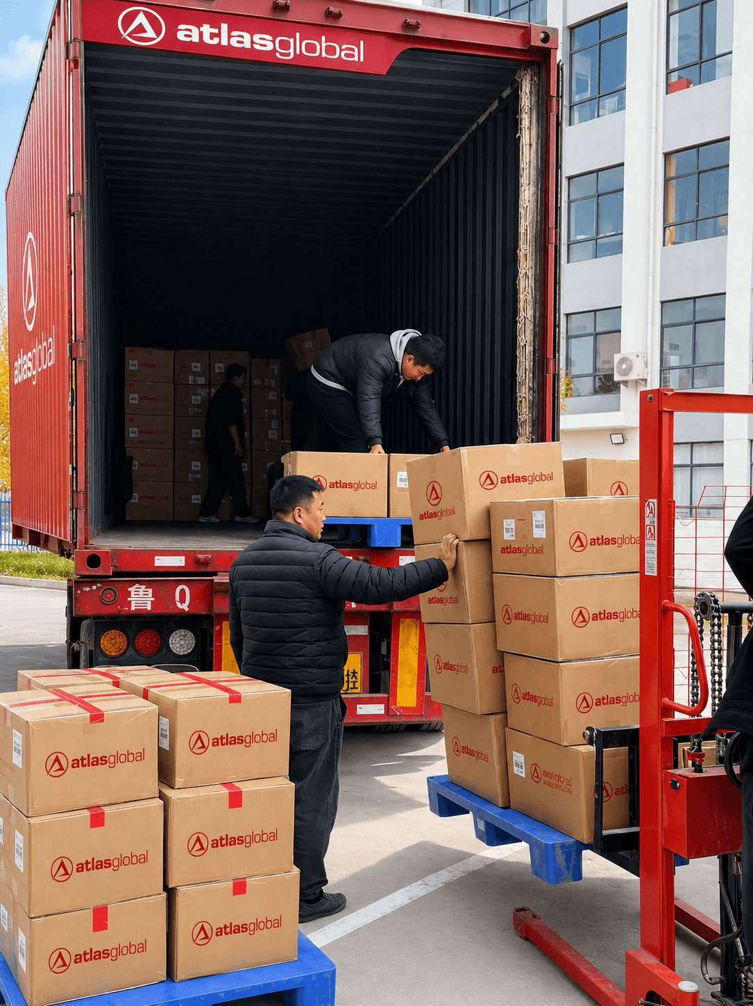 Atlas Global team loading branded boxes into the company cargo truck